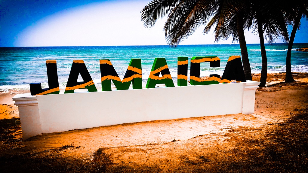 Colorful Jamaica palm tree beach and sunset